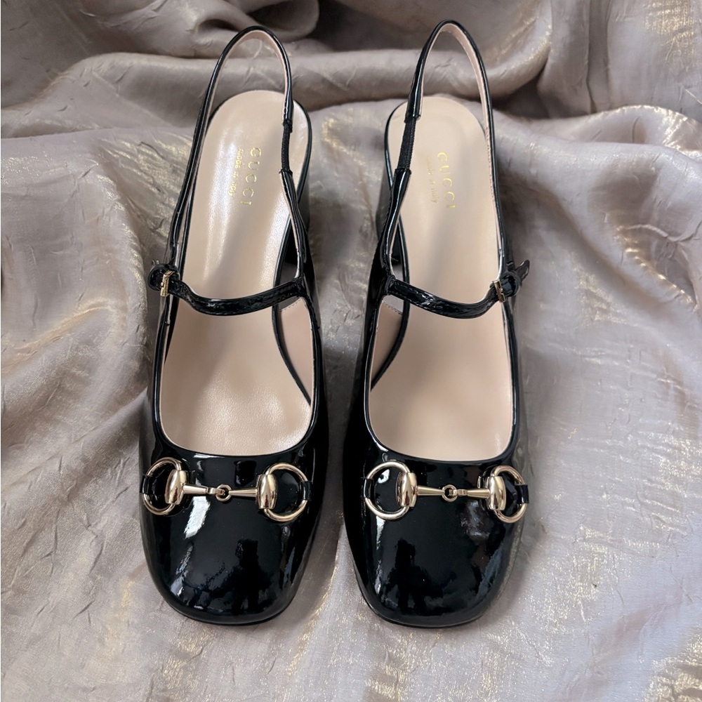 Black patent leather Horsebit slingback. Brand new and never worn.